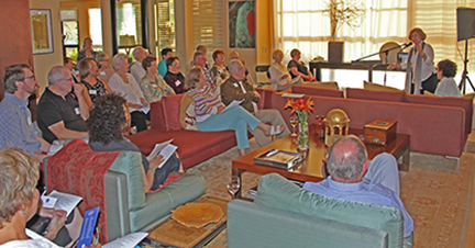 Attendees listen as keynote speaker addresses them from the podium