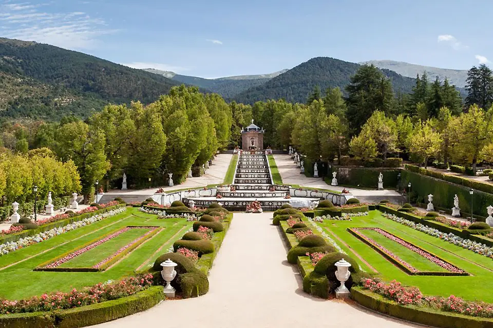 An elaborate garden featuring a symmetrical landscape.