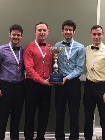 Zachary Cullery pictured in light blue with three other members of his barbershop quartet