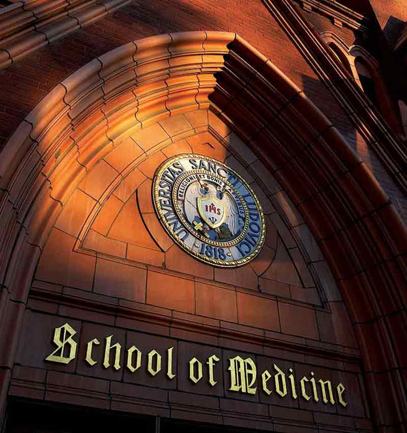 The exterior of Schwitalla Hall. "School of Medicine" is written on the sign below the university's seal.