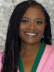 Smiling woman with long braids