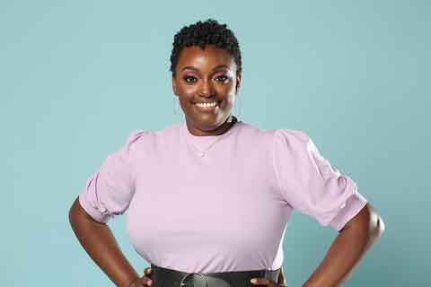 A portrait of Sharee Silerio, a Black woman with short curly hair, in front of a teal background.